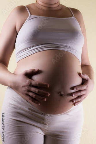 Pregnant woman take care about her belly