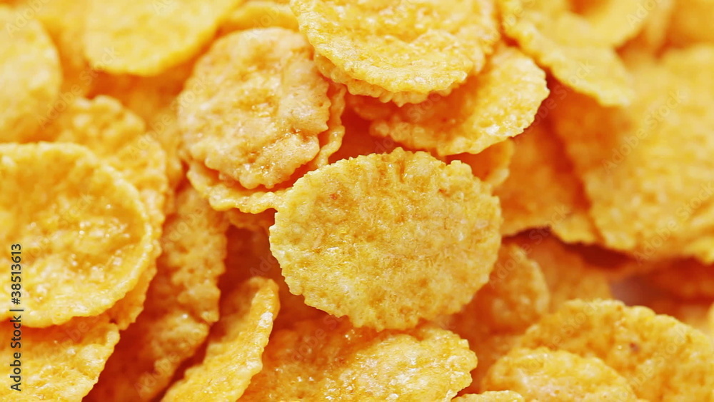 Rotating sweet corn flakes, macro view food background Rotating sweet corn flakes, macro view food background