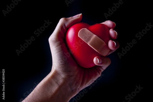 Hand Holding a Broken Heart