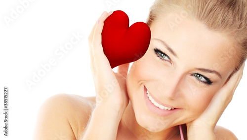 Isolated portrait of a beautiful female holding heart