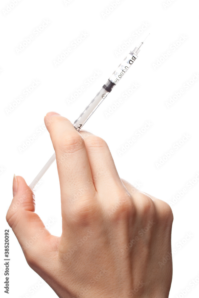 Female hand with syringe Female hand with syringe