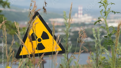 Radioactivity sign and the city.