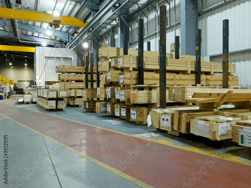Long wooden crates in an industrial storage aera