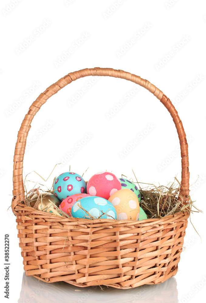 Colorful Easter eggs in the basket isolated on white Colorful Easter eggs in the basket isolated on white