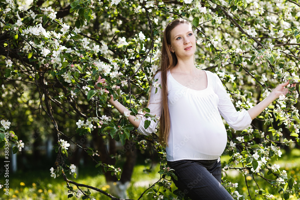 Beautiful pregnant woman relaxing in the park Beautiful pregnant woman relaxing in the park