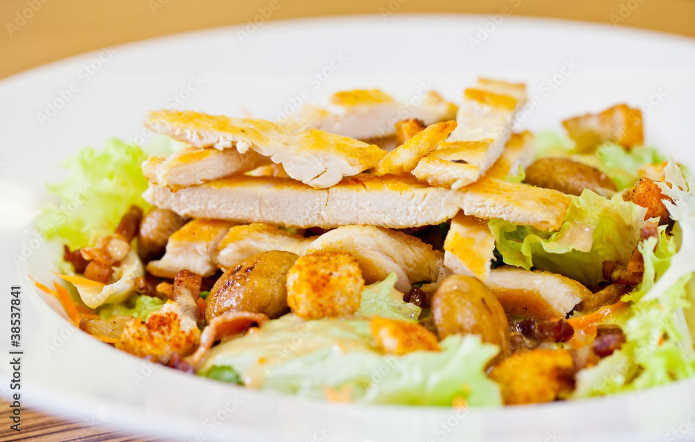 Chicken salad with grated carrots, mushrooms, bread croutons and