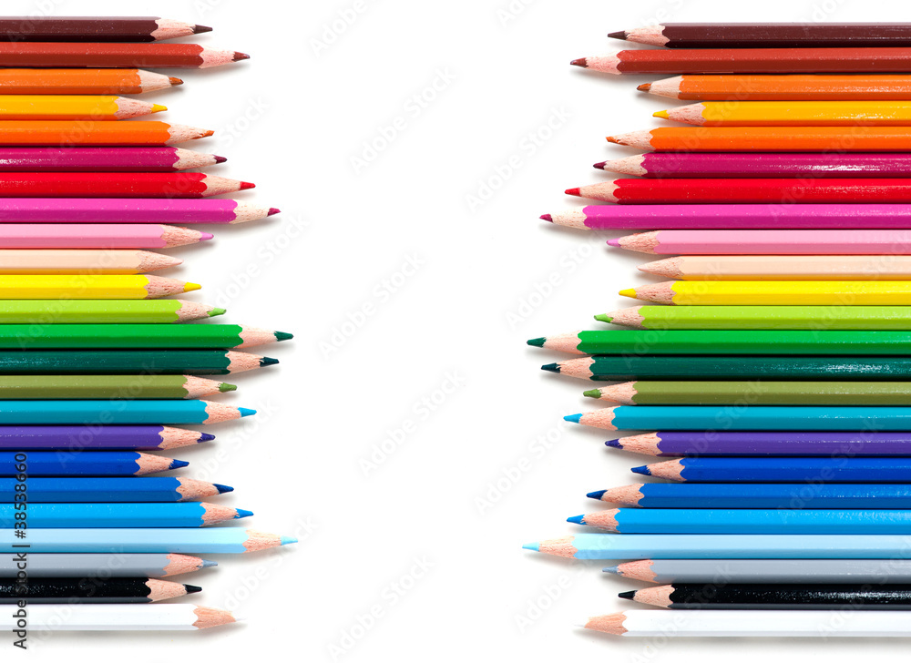 two groups of color pencils on white background two groups of color pencils on white background
