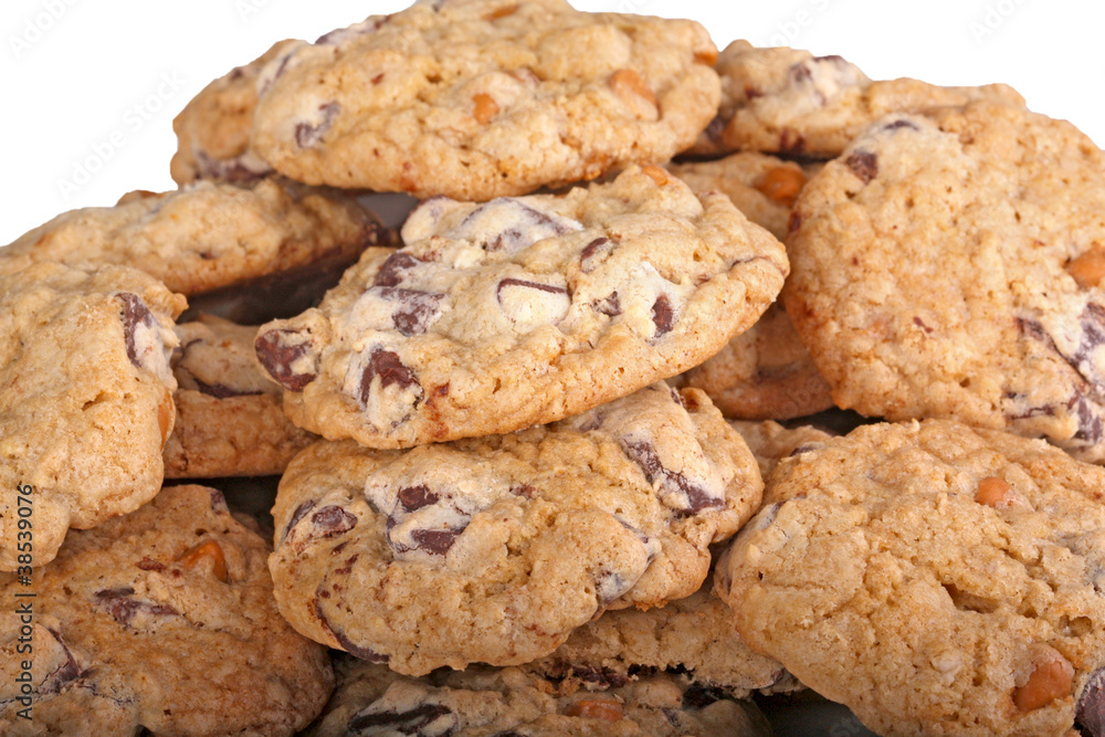 Mound of chocolate chip cookies against a white background Mound of chocolate chip cookies against a white background