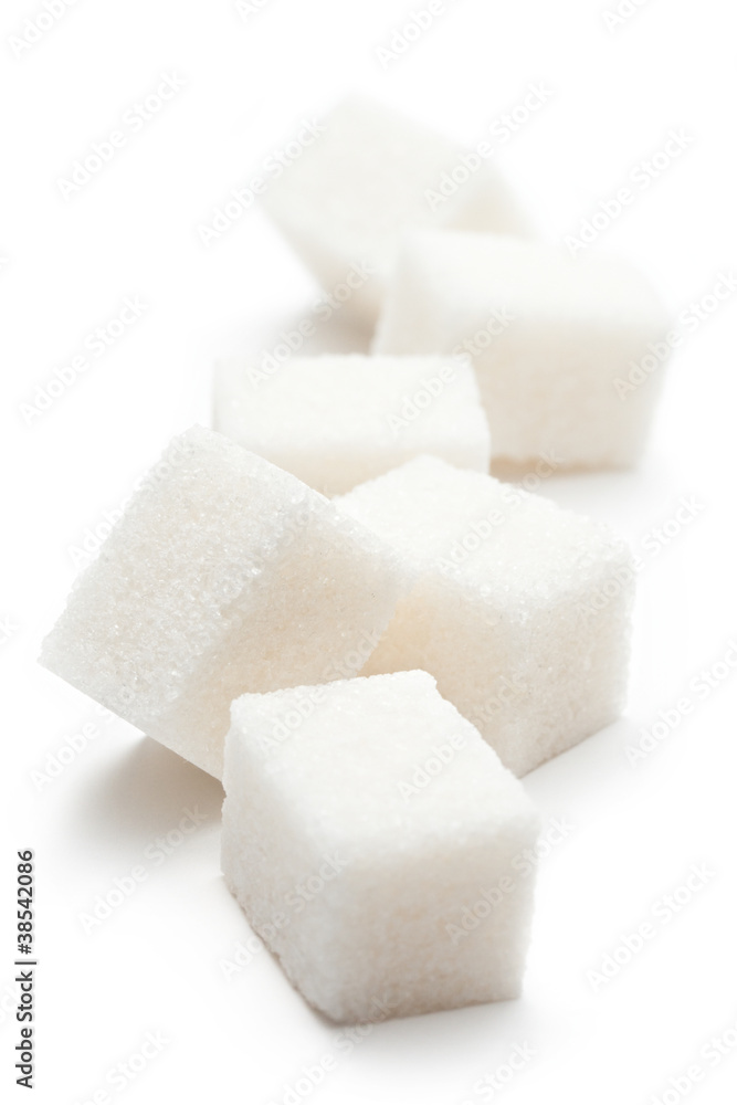 Cubes of sugar on the white background Cubes of sugar on the white background