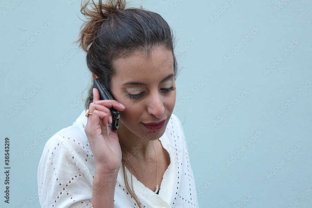 Beautiful young woman talking on mobile phone Beautiful young woman talking on mobile phone