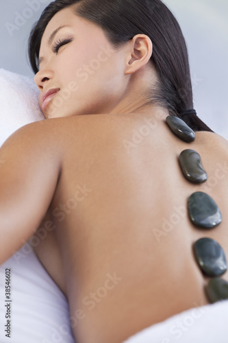 Woman Relaxing Health Spa Hot Stone Treatment Massage