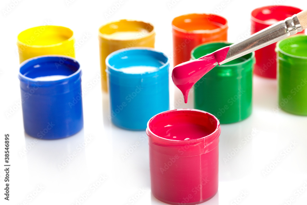 Paint buckets with paintbrush over white background Paint buckets with paintbrush over white background