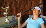Female tennis champion relaxing