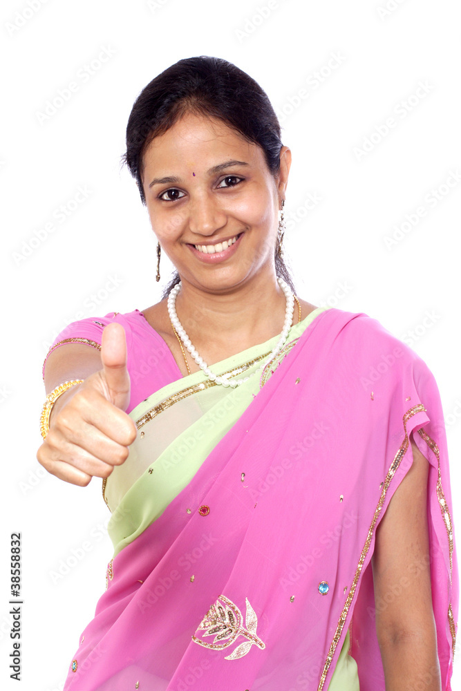 Traditional young Indian woman showing thumbs up Traditional young Indian woman showing thumbs up