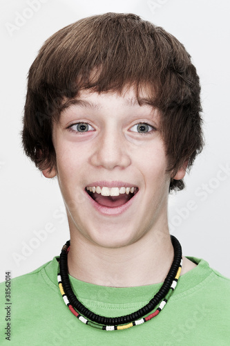 potrait of young guy which has is mouth open with visible teeth