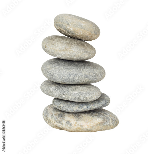 A stack of slightly off-balanced zen stones isolated on white ba