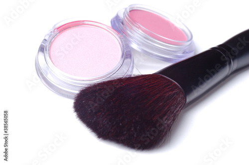 Pink make up powder with brush  on white photo