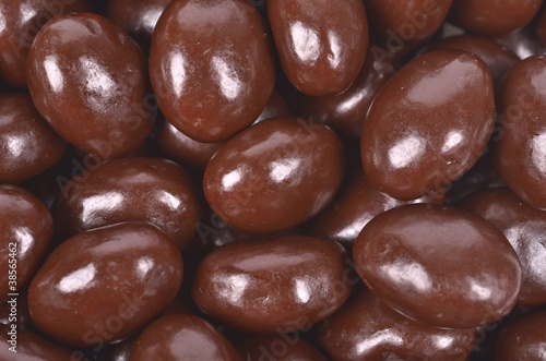 Dark brown dragee, chocolate covered nuts,