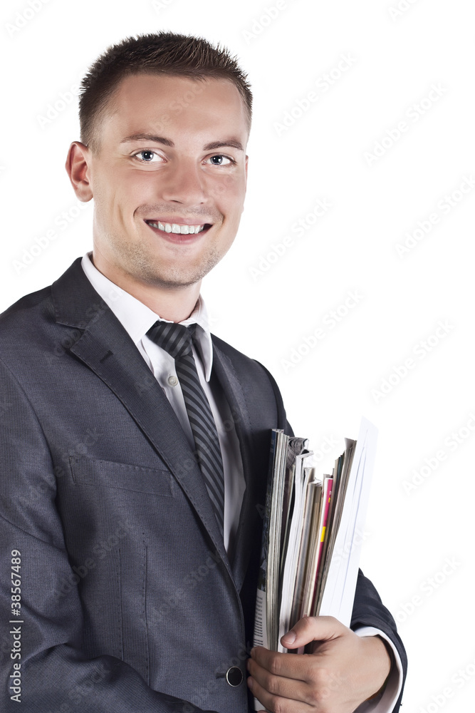 Portrait of a businessman standing and smiling isolated ower whi