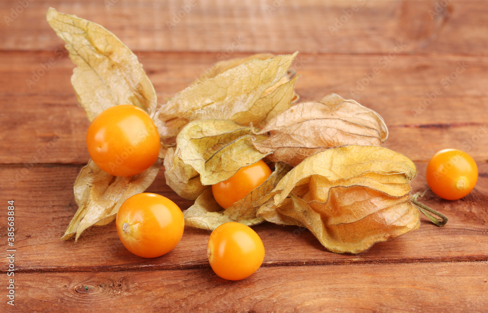 Physalis heap on wooden background Physalis heap on wooden background
