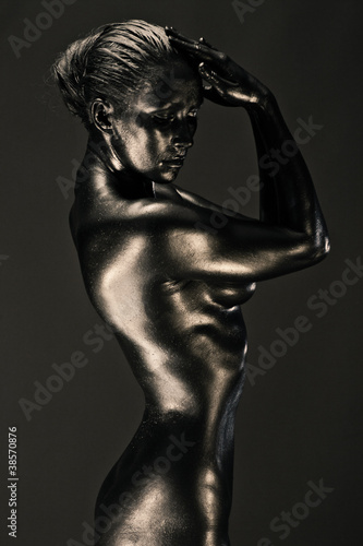 Nude woman like statue in liquid metal © honored