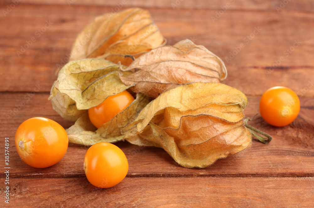Physalis heap on wooden background Physalis heap on wooden background
