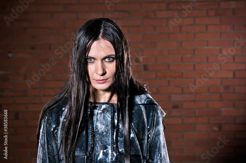 Fényképezés Angry woman with wet hair after the rain