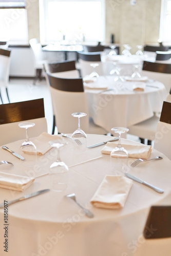 Tables set for meal © Maksim Shebeko