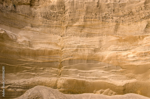 Geological layers of earth in deep sand pit