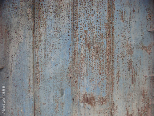 old wooden surface with cobweb and peeling crack blue paint