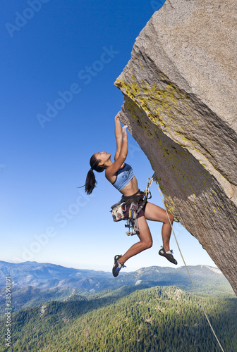 Rock climber dangling.