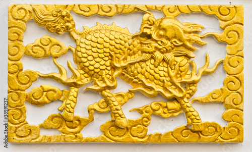 Golden dragon-headed unicorn craft on wall