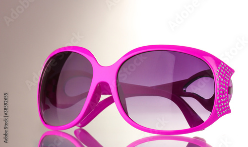 Women's pink sunglasses with diamonds isolated on white
