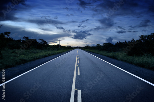 Remote road at sunset photo