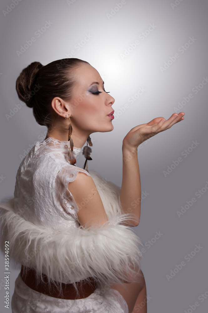 Elegant woman sending kiss