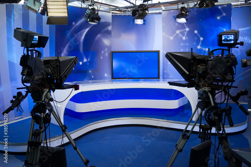 TV studio with camera and lights photo
