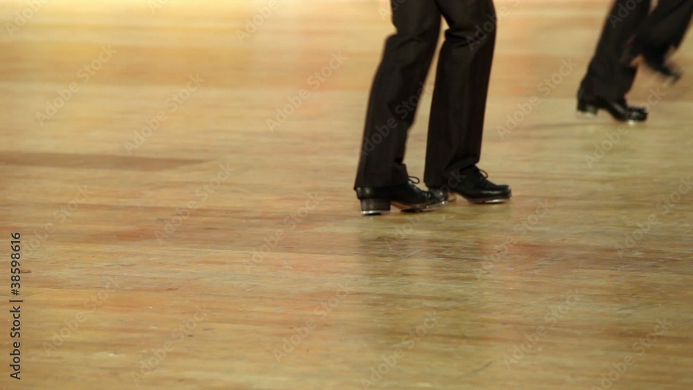 Few boys in shoes with taps and black pants tap dance Few boys in shoes with taps and black pants tap dance