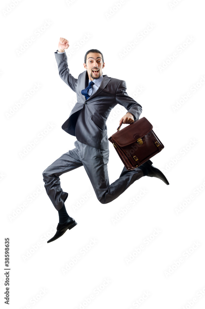 Businessman jumping on white