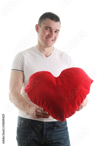 Man with a heart shaped pillow © IngridHS