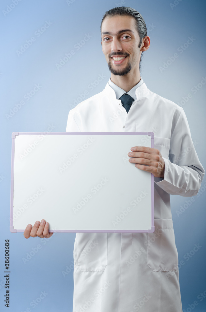 Doctor with blank message board Doctor with blank message board