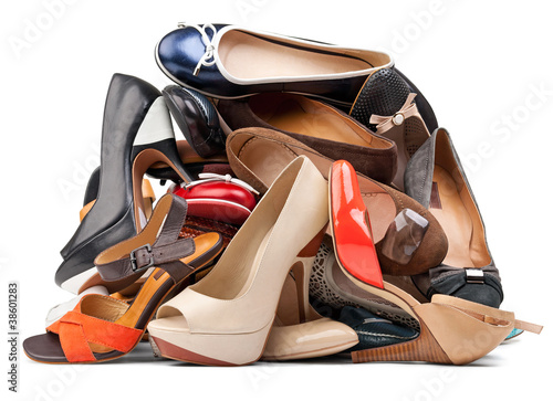 Pile of female shoes over white, with clipping path