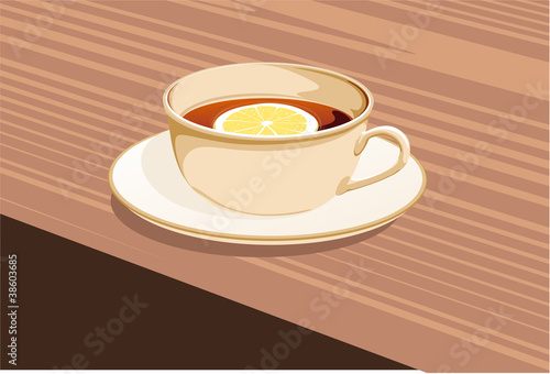 cup of tea and a lemon stands on a saucer