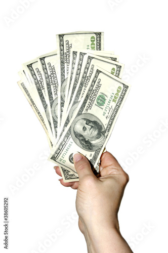 рука держит банкноты долларов