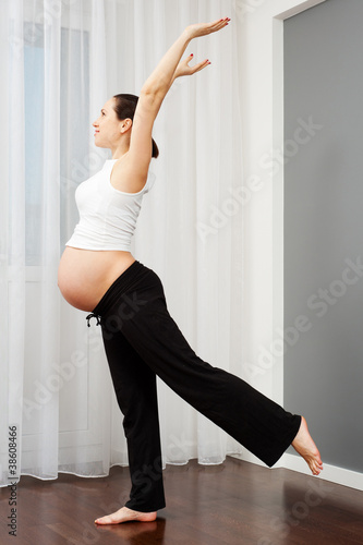 pregnant woman doing exercise at home