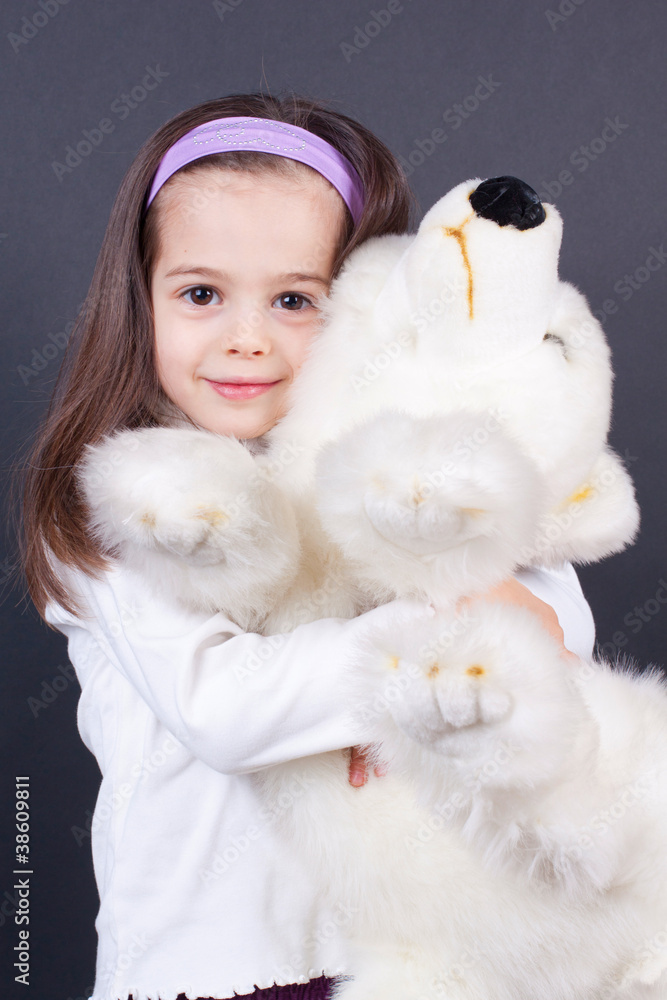 Little girl's hugging a bear Little girl's hugging a bear