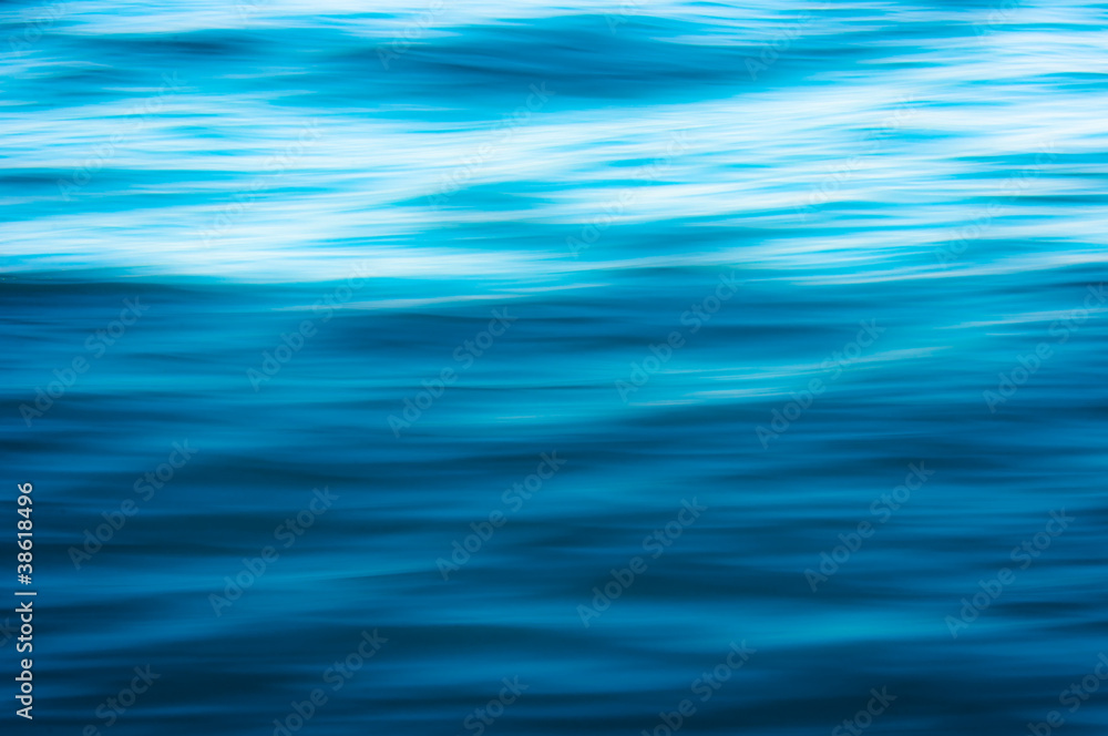 Beautiful blue water surface as a background texture Beautiful blue water surface as a background texture