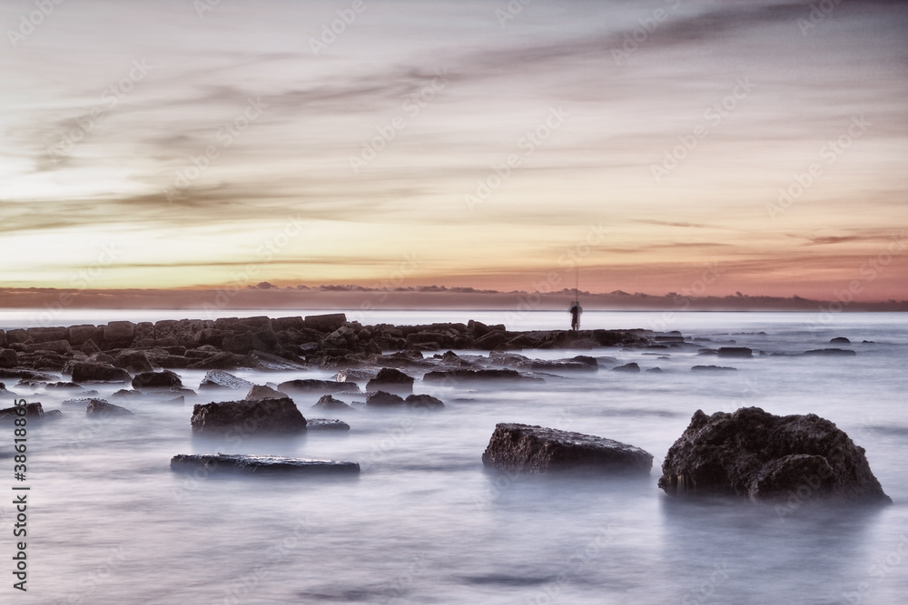 fisherman at sea with cane. Portugal.