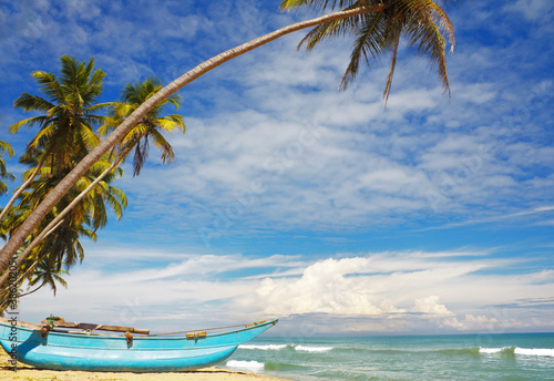 Sri-Lanka sunny coast with fishers boat