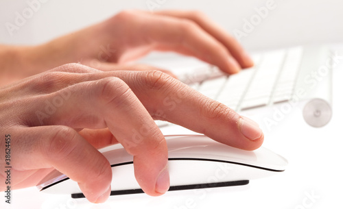 man typing with keyboard