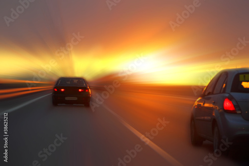 car at sunset on the highway